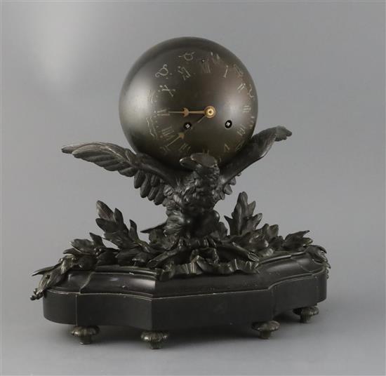 A late 19th century French bronze mantel clock modelled as a globe supported by an eagle, width 14in. height 13in.